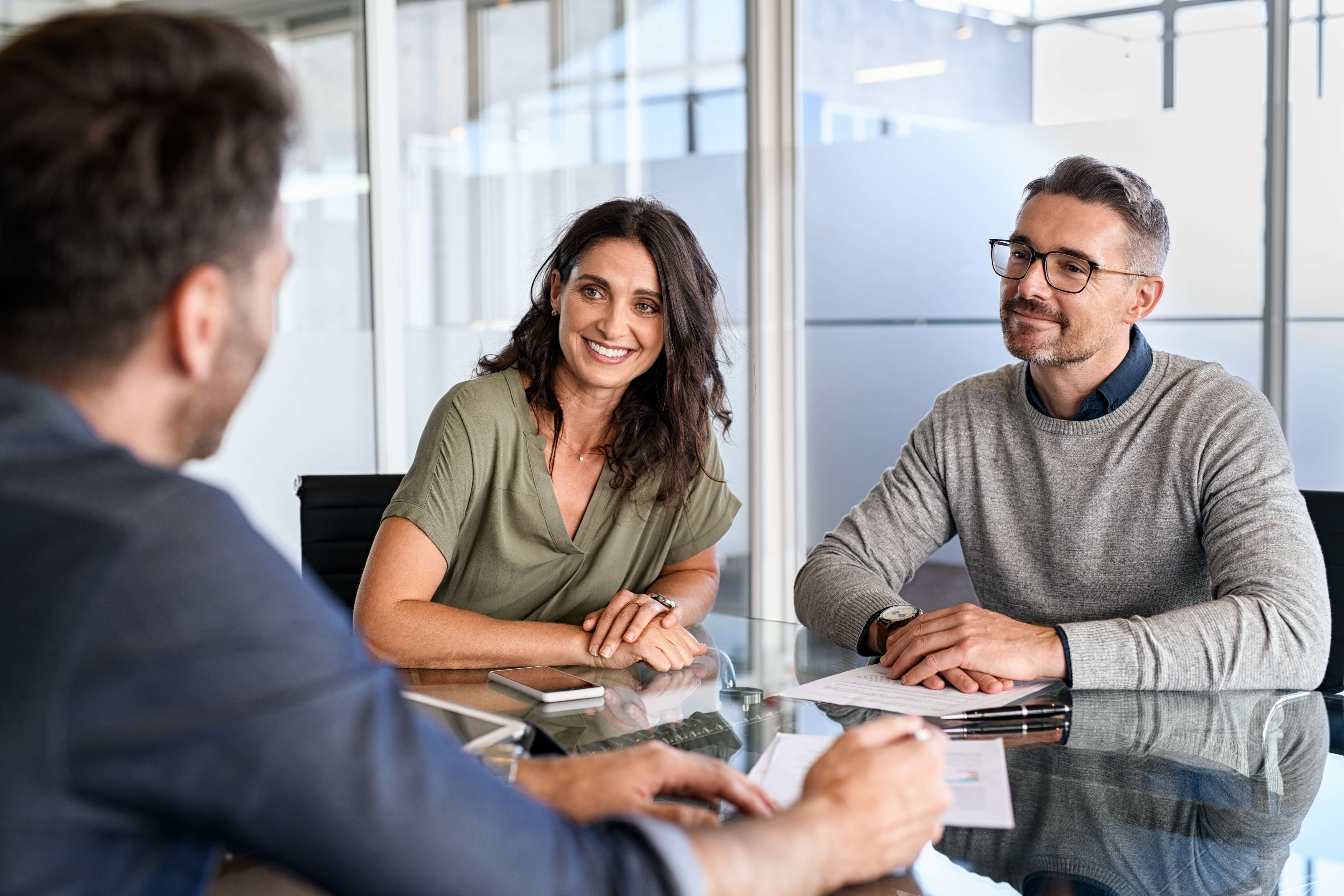 Couple meeting with an insurance professional, representing personalized guidance when selecting homeowners coverage in North Carolina.