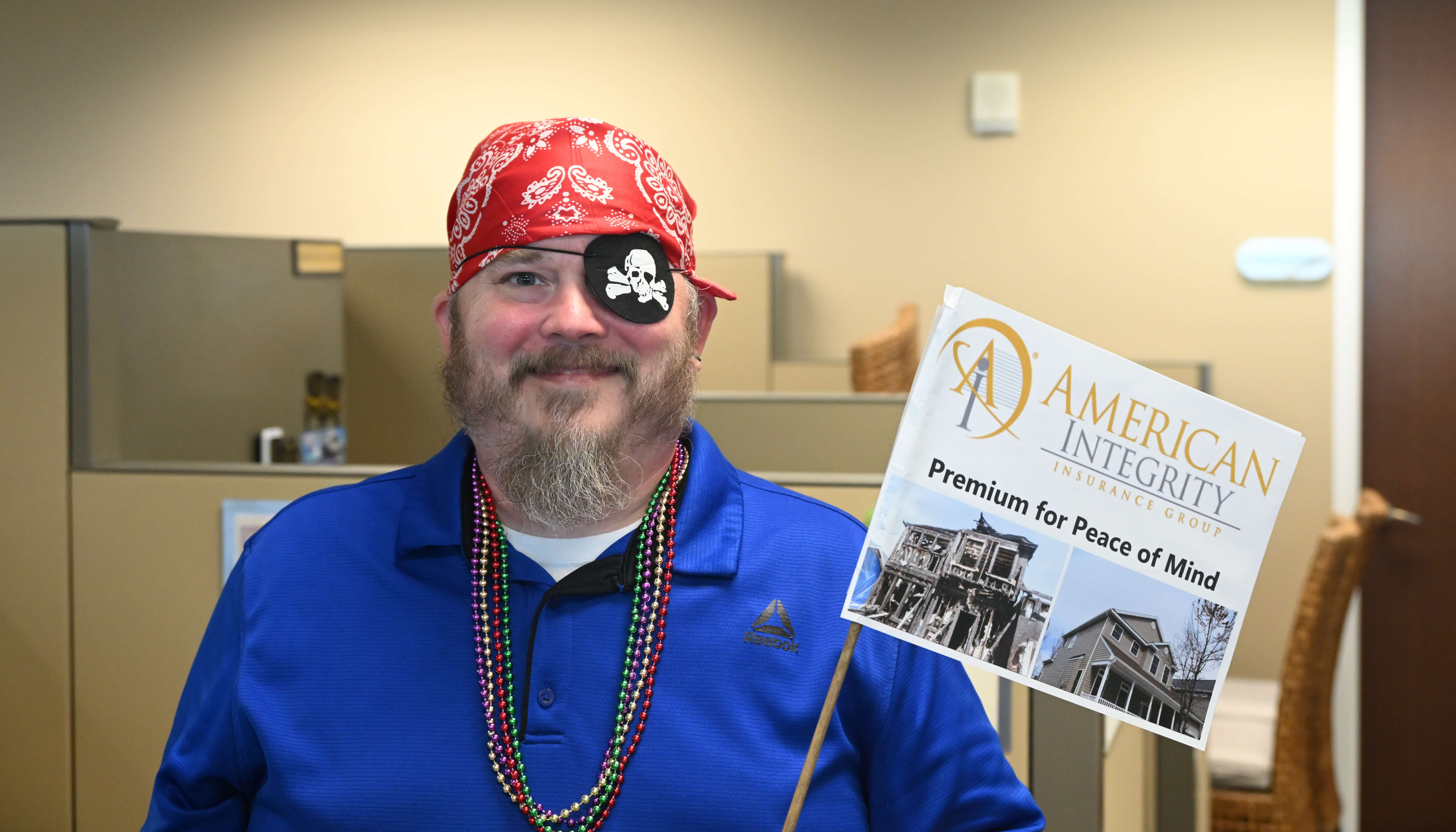 Claims team member dressed up like a pirate in celebration of Gasparilla